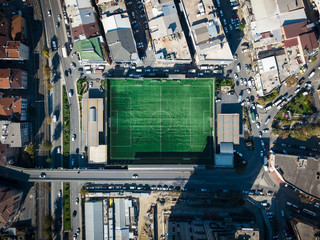 aerial view of a football field in residental area. top view of football pitch © ucarer