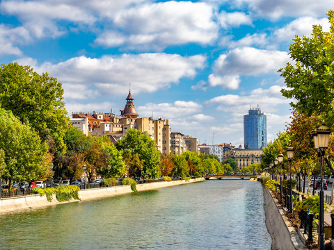 Dambovita river across the city of Bucharest in autumn season, Romania