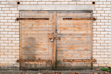 Garage door with padlock and hinges