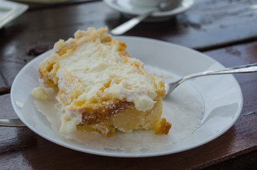 Typical Italian and Sicilian dessert – role pasta di bigne with ricotta. Closeup of italian dessert on the table in the bar.