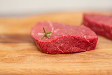 Raw beef meat on a cutting board
