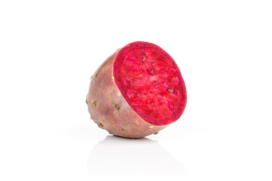 One half of fresh bright prickly pear opuntia isolated on white background