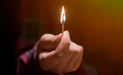 huge massive fire and burning match in hands in the dark f
