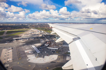 Aerial view of Copenhagen airport or Kastrup airport from window seat of airplane takeoff over Copenhagen Airport for passenger transportation in Denmark to another location in Europe