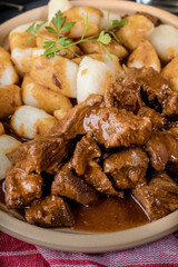 Beef stew with potatoes dumplings.