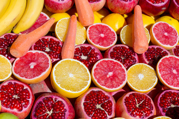 Oranges, pomegranates, grapefruits, carrots, bananas are colorful and beautiful and they will be delicious fruit juice