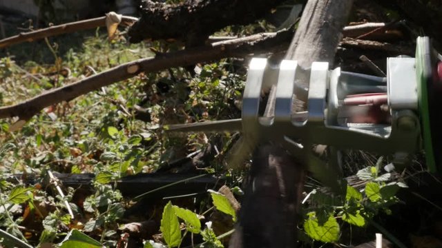 Slow Motion Reciprocating Saw Used In The Garden Close-up Video