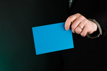 Businessman Holding a Blue Card, Empty, Copy Space, Gradient Green background