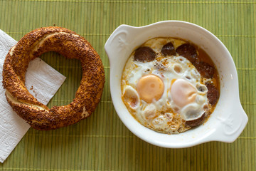 breakfast with traditional turkish simit and sucuk egg