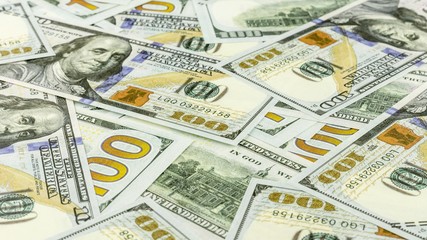 Pile of hundred dollar banknotes. - Business backdrop.