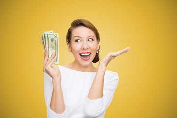 Cheerful woman with pile of bills