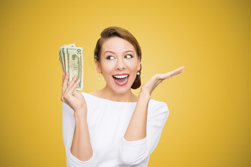 Cheerful woman with pile of bills