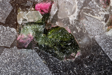 Macro mineral tourmaline stone in quartz on a white background © Minakryn Ruslan 