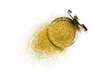 Powder highlighter in a silver powder box with gold sparkles reflected in the mirror. Isolated on white background.