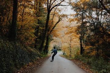 Man Skating in the Autumn Forest in Germany