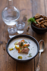 Traditional Finnish Salmon and cream soup - lohikeitto, selective focus