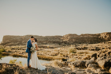 Beautiful Couple on their Wedding day in front of landscape