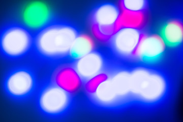 The abstract blurred multi-colored bokeh. Christmas, New Year, holiday, festival, carnival background