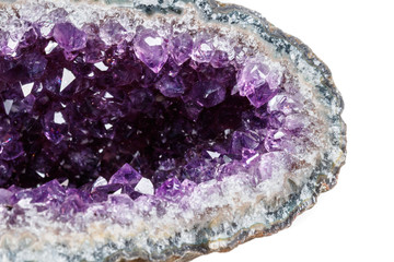 Macro Mineral Stone Amethysts in the rock on a white background - obrazy, fototapety, plakaty