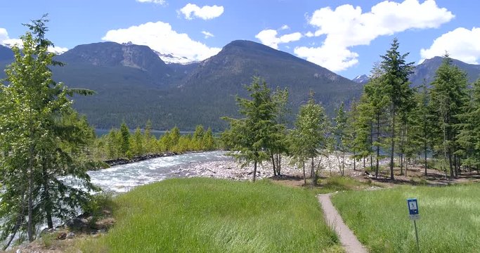 Majestic mountain river in Devis Creek, Vancouver, Canada. Drone flying. Aerial view with mountain background.
