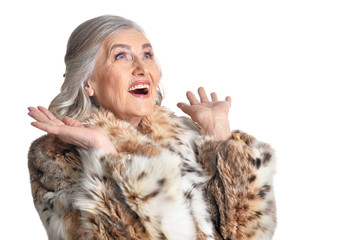 portrait of beautiful senior woman in fur coat
