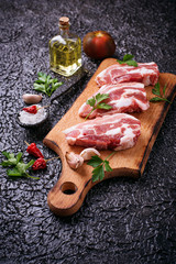 Raw pork meat and ingredients for cooking