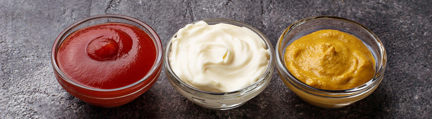 Set of different sauces: mustard, ketchup, mayonnaise. 