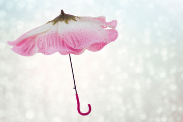 Umbrella with flower shape on a rainy day