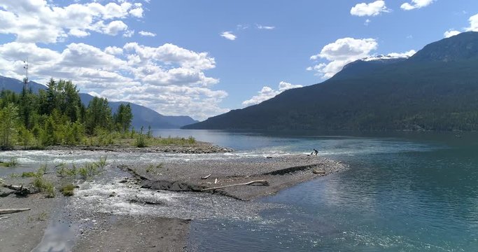 Majestic mountain river in Devis Creek, Vancouver, Canada. Drone flying. Aerial view with mountain background.