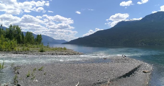 Majestic mountain river in Devis Creek, Vancouver, Canada. Drone flying. Aerial view with mountain background.
