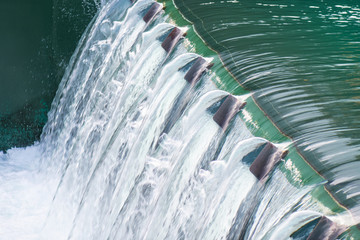 Detail of a dam with flowing water - Powered by Adobe