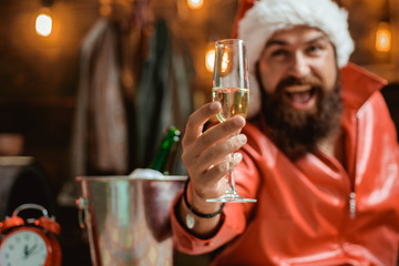 Handsome Christmas Santa Claus. Happy people partying with champagne. Merry christmas and Happy new year. Wish you merry christmas.