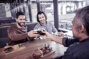 Cheerful colleagues celebrating finishing of their project