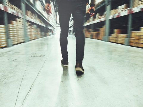 man walking in industrial store