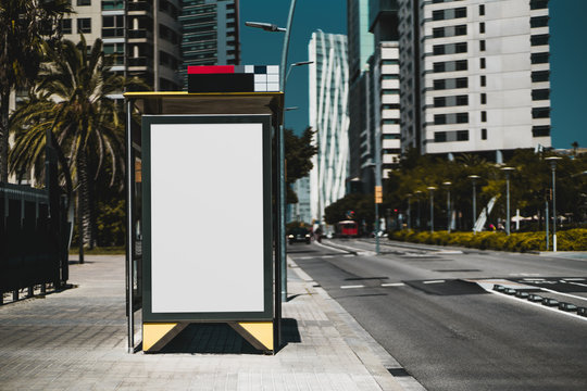 Empty billboard placeholder template on the bus stop with the road on the right; blank advertising banner mock-up in urban settings; white empty informational signboard near the highway