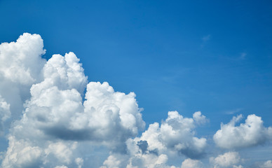 Naklejka na ściany i meble Blue sky with a white clouds