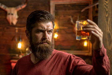 Barman with whisky or brandy. Bearded man drinking alcohol. Drink and celebration party concept. Degustation and tasting.