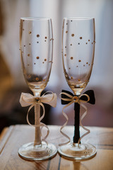 Beautiful wedding glasses for the newlyweds. Champagne glasses. glasses of the bride and groom for the wedding