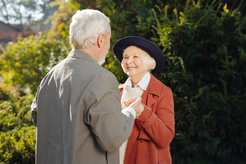 Fototapeta premium Cheerful happy woman looking at her husband