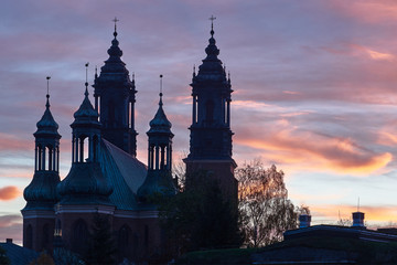 Fototapeta premium Towers of medieval Gothic cathedral in the evening in Poznan.