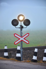 Traffic light shows white signal on railway