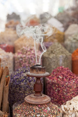 Arabic traditional incense bukhoor agar wood burner in with smoke, used in majlis, Ramadan and Eid occasions