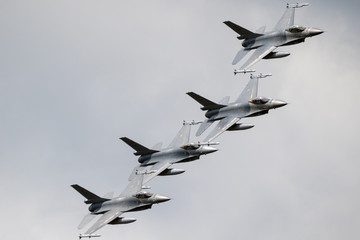 Military fighter jet aircraft formation in flight - Powered by Adobe