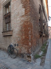 Ferrara, Italy. Medieval zone and broken bike.