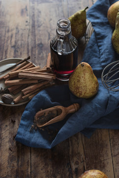 Fresh pears near spices and wine