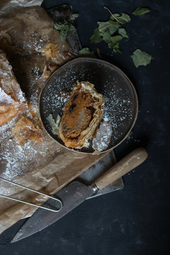 Knife near piece of strudel