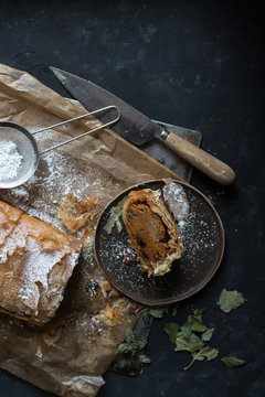 Knife near piece of strudel