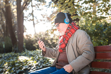 Pleasant aged man resting in the park