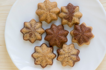 Cinnamon sandbakelse christmas cookies, two color, cocoa dark brown and vanilla light golden brown, delicious czech cookies