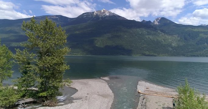 Majestic mountain river in Devis Creek, Vancouver, Canada. Drone flying. Aerial view with mountain background.